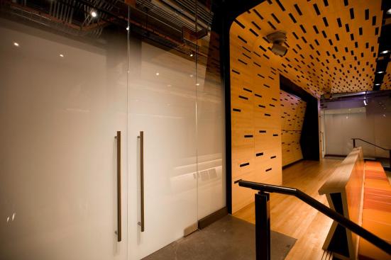 Doors and transom in ViviGraphix Gradiance glass with Standard finish and Scatter interlayer at the Elinor Bunin Munroe Film Center in New York, New York