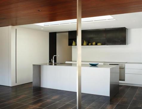 This remodeled kitchen represents an effort to project the vocabulary of Richard Neutra the houses original architect into the present day.