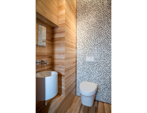 The floor, walls, and ceiling of continuous maple strips