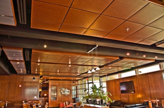 Luxurious donors? and private suites, renovated USC Champions Club and Executive Club with Chicago Metallic's Planostile? metal ceiling panels with a MetalWood? woodgrain finish