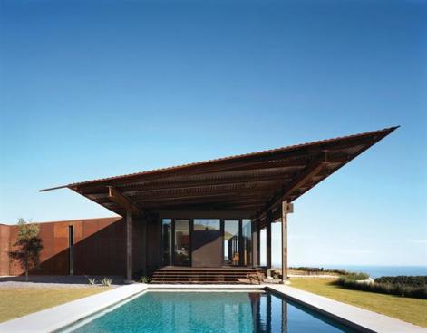 The roof shields the house from the sun and tips up toward the view. 