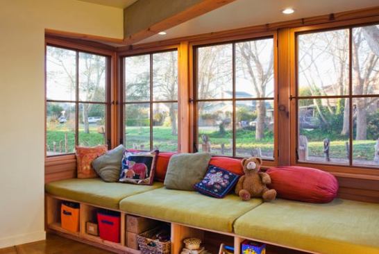While straw-bale walls wrap the north and west sides of the house, the wood-framed south wall has lots of windows, bringing daylight into the living spaces.
