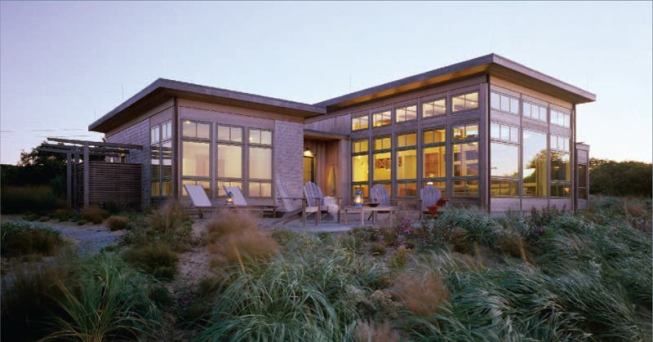 This vacation home combines contemporary planning and detailing with archetypal beach-cottage cues.