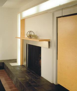 A custom, L-shaped light fixture surrounds the detail. Its fluorescent bulbs shine through Lumasite casing for a natural, sunlit effect.