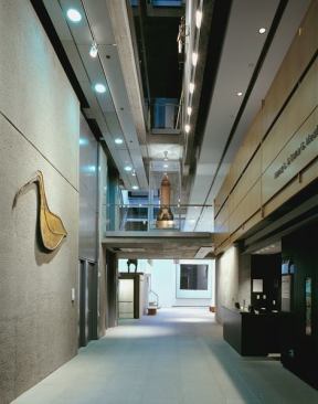 Openings between floors allow light to pass from the upper level skylights to the galleries below.
