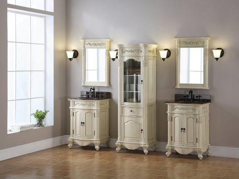 Dual Windsor 24-inch vanities shown with coordinating mirrors and linen tower in Antique Bisque finish.