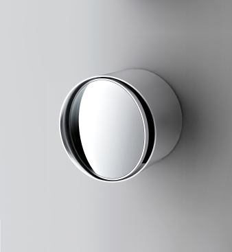 The stainless steel wall-mounted Index is reversible: it offers a 4-millimeter-thick standard mirror on one side and a magnifier on the other.