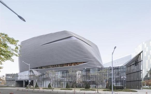 The+first+floor+is+a+transparent+base+that+invites+people+in%3b+the+upper+levels+house+showrooms+and+are+largely+windowless.