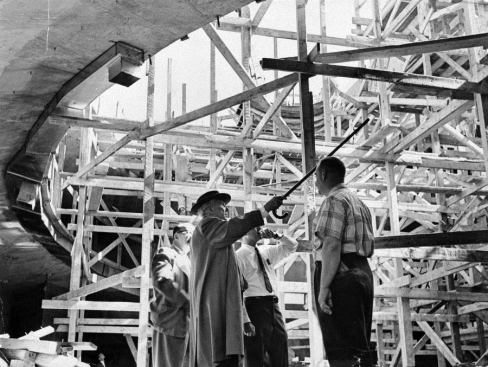 Wright directing construction with his cane.