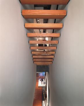 A narrow stairway provides another circulation route through the building.