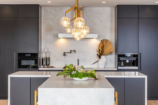 Modern luxury kitchen island breakfast bar at Los Angeles mansion.