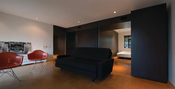 Wheeled millwork components move to create a variety of interior configurations.