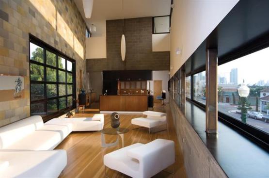 Snazzy interiors, which feature walls of standard masonry colors laid in a random pattern, hold their own against the buildings extreme surroundings.