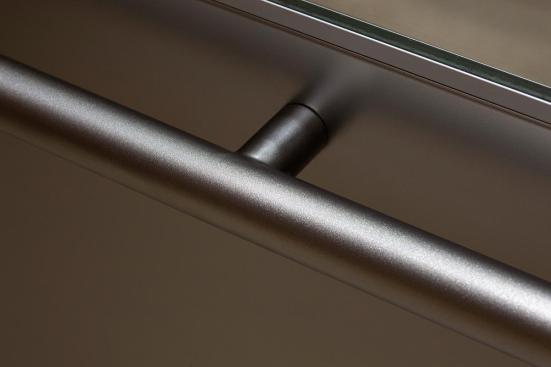 Sextant Handrail in Stippled Stainless Steel shown in CabForms Series 2000-N Elevator Interior with handrail panel in Stainless Steel with Seastone finish at the Woolworth Building, Eugene, Oregon