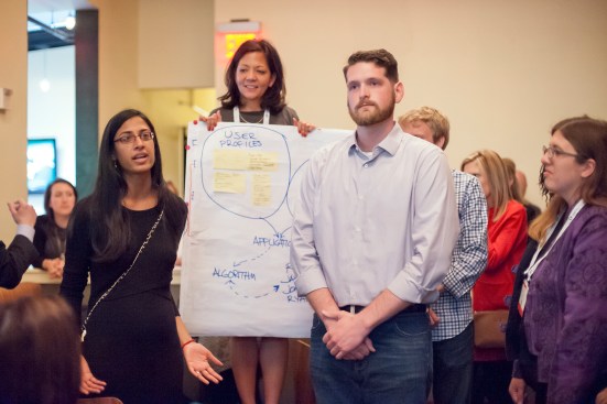The winning team reenacts its pitch at the happy hour.