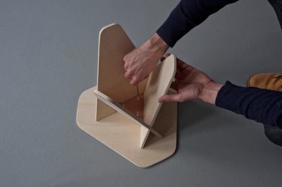 The tabletop&nbsp;can be screwed into place from the underside of the table.