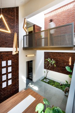 Double height dining space and bridge above.