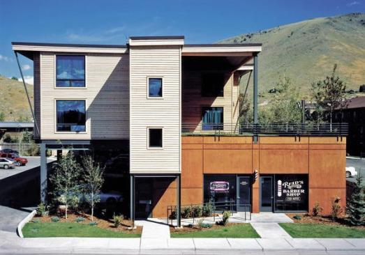 An acid-based stain gives the building's concrete base a terra-cotta coloring to better blend with its surrounding landscape. 
