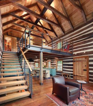 The remaining second level of the 1840 cabin overlooks the home's main living space.