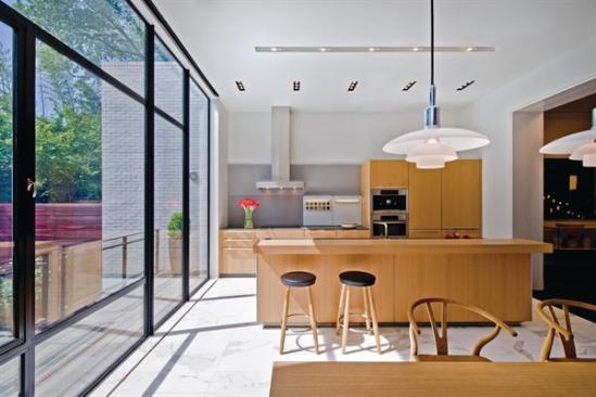 A new kitchen added onto the back of the house received modern detailing, distinguishing it from the older portions of the building. 