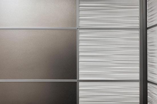 LEVELe-103 Elevator Interior with main panels in Stainless Steel with Sandstone finish; accent panels in Bonded Quartz, White with Kalahari pattern; Compass handrails in Satin Stainless Steel at Florida Hospital Celebration Health, Celebration, Florida