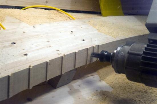 CNC+machines+cut+seat+cuts+into+each+of+the+curved+beams.