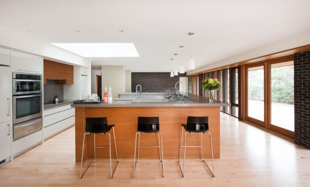 Kitchen is the hub of the home with a large, teak U-shaped island