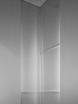 Two+blackout+shades+create+a+unique+corner+condition.+The+reflected+light+illuminates+a+corner+in+a+ghostly+way.++