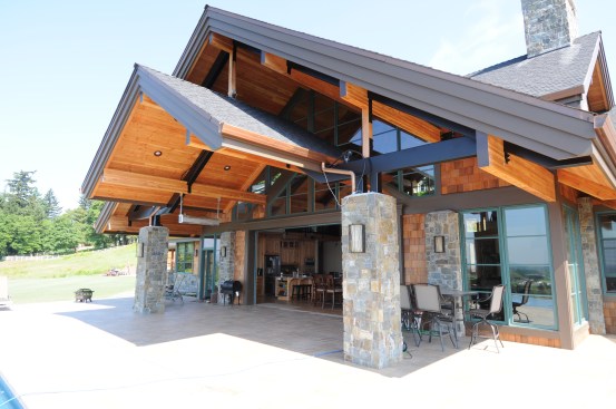 The double awning serves to maximize natural light penetration while minimizing glare