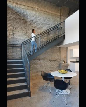 Live/work units on the former loading dock have their own sidewalk entrance and stairs to a sleeping loft. 