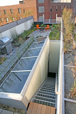 A 6-inch-deep green roof, rainwater cistern, heat-recovery unit, and other sustainable strategies help the project promote energy efficiency and conservation