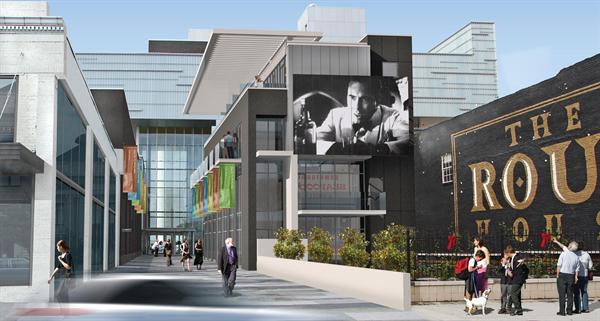 Commercial spaces on the ground floor energize the street. 