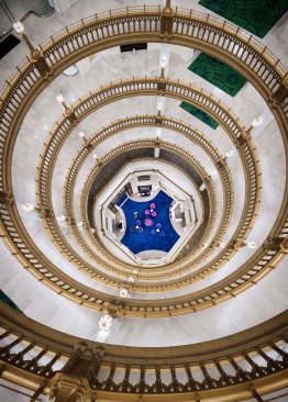 The ground floor is split into quadrants by cross-axes emanating from a central rotunda that features a grand ten-story atrium. A total of 19,060 square feet of luxurious hand-tufted New Zealand wool carpeting was used throughout the building. 