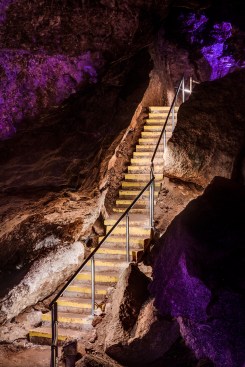 Illuminated cavern stairway.