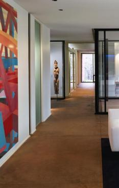 A piece of sculpture is framed by the indented entry hall.