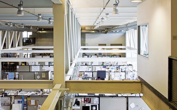"The guts of the building are hanging out, in an instructional sense," says Predock, when describing the building's interior. All systems are exposed, from the massive steel trusses to cable trays that snake along the ceilings, bringing power and network operations to every workstation. The exterior walls--of poured-in-place concrete tinted an adobe tone to match the other campus buildings--are exceptionally thick. The thickness accommodates a plenum that creates airflow in an inductive-air system.