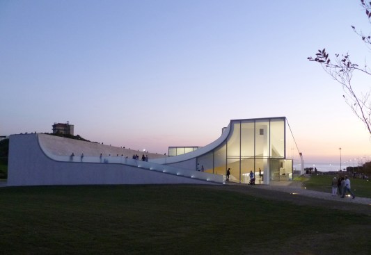The museum and the ocean beyond at dusk.