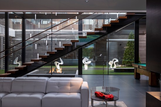 Serenity Indian Wells luxury modern mansion entertainment lounge & dance room with Ruben's Tube fireplace