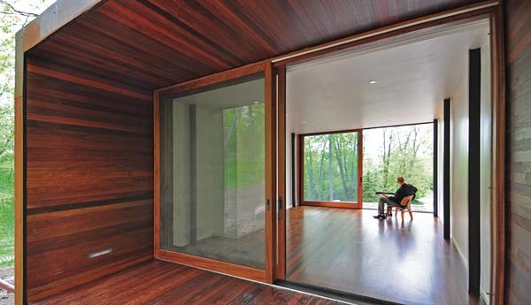 Ipe lines the porchs floor, walls, and soffit.