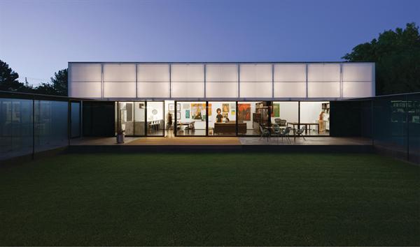 When lifted, the live/work pavilion's operable polycarbonate awning becomes a giant lantern.