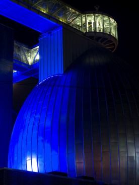 Lighting design firm L-Observatoire International sprinkled the expansive industrial landscape with accents of blue. The result is a diaphanous veil of colored light that defines the boundaries of the plant.
