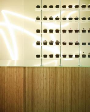 At More Cupcakes, a new store in Chicago's Gold Coast neighborhood that was designed by David Woodhouse Architects, the humble cupcake is treated like the main design object of an otherwise minimal, meticulously detailed interior.