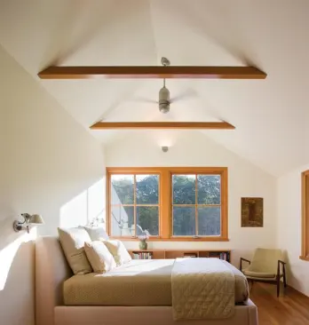 For owners who wanted a contemporary home that also channels the aesthetic of surrounding rural Rhode Island farms, warm wood windows combine with heart-pine floors and exposed joists to counterbalance the lower level’s extensive use of steel and glass. Project: Field House, Sakonnet, R.I.; Architect: Estes/Twombly Architects, Newport, R.I.; Builder: Highland Builders, Tiverton, R.I.