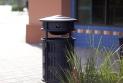 Urban Renaissance Litter & Recycling Receptacle shown in side opening with integrated recycle bin configuration with Vertical grillwork and Black Texture powdercoat at BART, Pleasant Hill/Contra Costa Centre Station, Walnut Creek, California