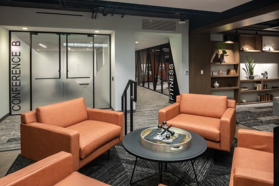 To accommodate varying floor heights and existing mechanical systems, a raised area defines one of several lounges. 