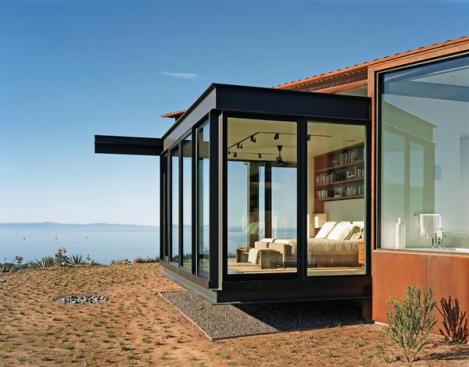 The master bedroom floats in a steel frame. 