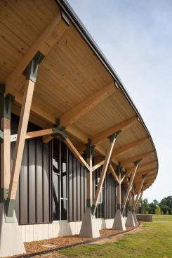 The+Welcome+Center%27s+exterior+consists+of+two+types+of+exterior+walls+-+the+board-formed+concrete%2c+and+this+prefinished+bronze-colored+metal+standing-seam+siding+over+gypsum+sheathing.