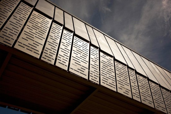 Bridge upper panels in Stainless Steel with Sandstone finish and custom Eco-Etch pattern; lower panels in Stainless Steel with Sandstone finish and custom screen pattern at the Houston Ballet Center for Dance, Houston, Texas