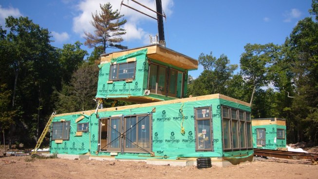 Prefab modules being set by crane