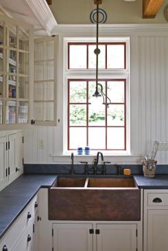 The single-story kitchen, connected by a hyphen, makes perfectly clear where the historic house ends and the new part begins.